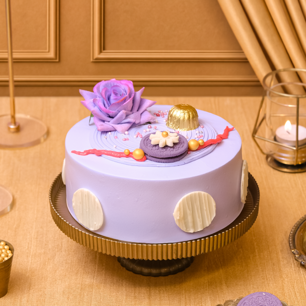 Happy Rakhi Cake, a Korean cookie cream cake for Rakhi with purple cream and rose decoration