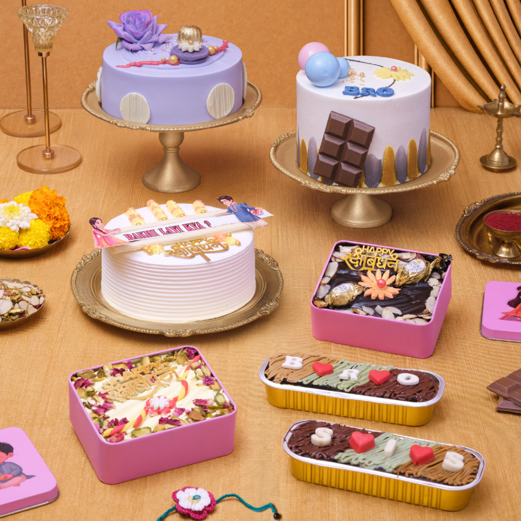 Monginis Rakhi cake collection with pencil cakes, photo cake, and festive pastry boxes