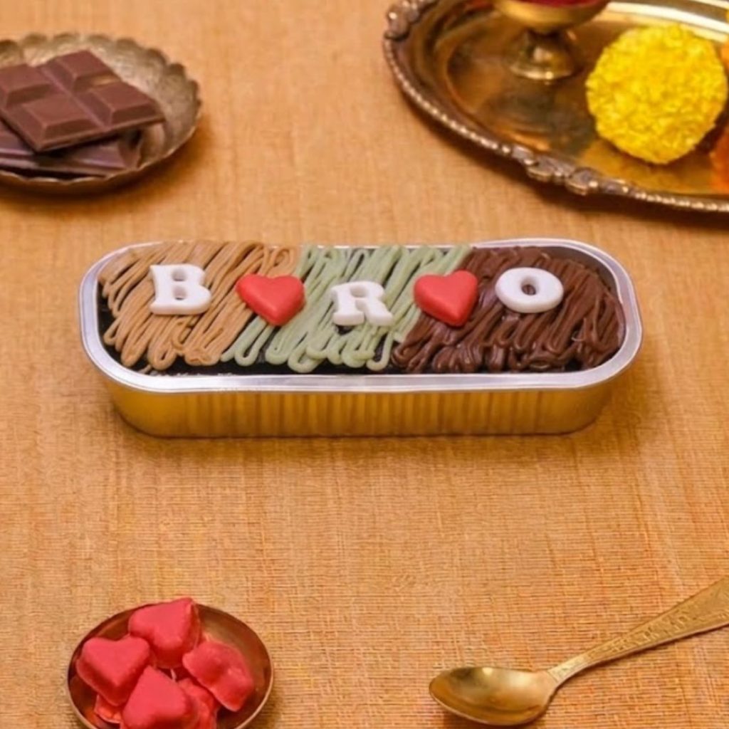 Bro Love Raksha Bandhan Cake, a chocolate Rakhi cake for brother with 3D BRO lettering