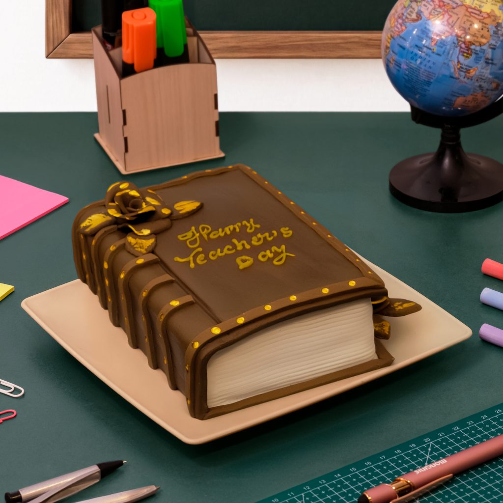 Large chocolate dessert with marzipan detailing shaped like a vintage hardcover book