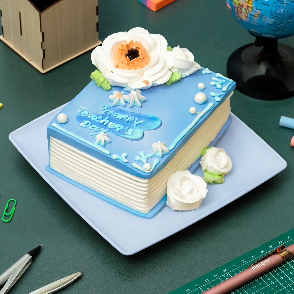 Book-shaped dessert with blueberry cream filling and blue-white finish