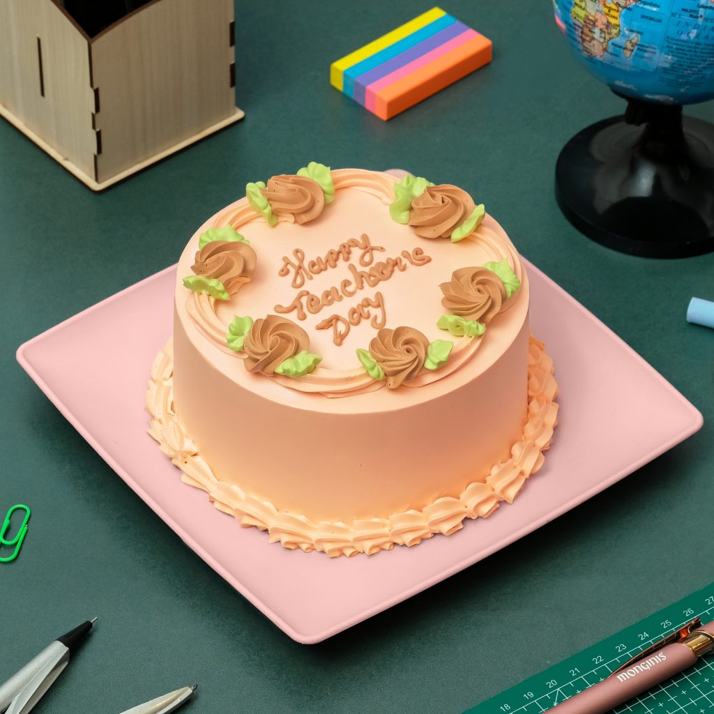 Round cake with peach salted caramel finish and buttercream rosettes